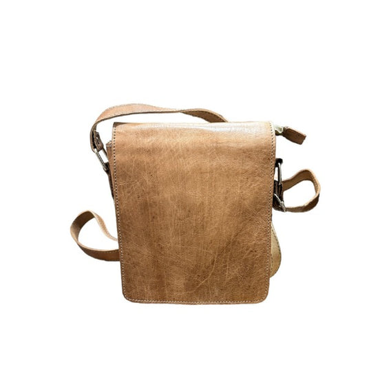 a brown leather bag on a white background