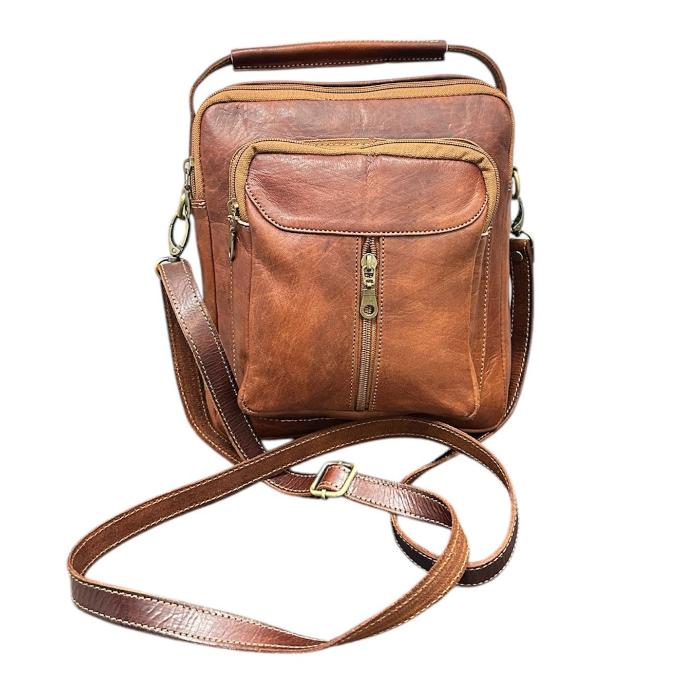 Natural leather travel backpack with zipper.