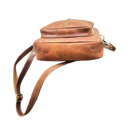 Natural leather travel backpack with zipper.